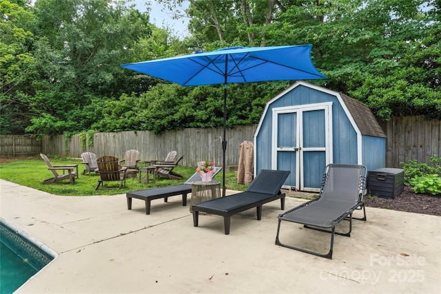 6313 Weddington Rd, Concord, NC 28027 - fenced backyard with a storage unit, a patio area, and a fire pit