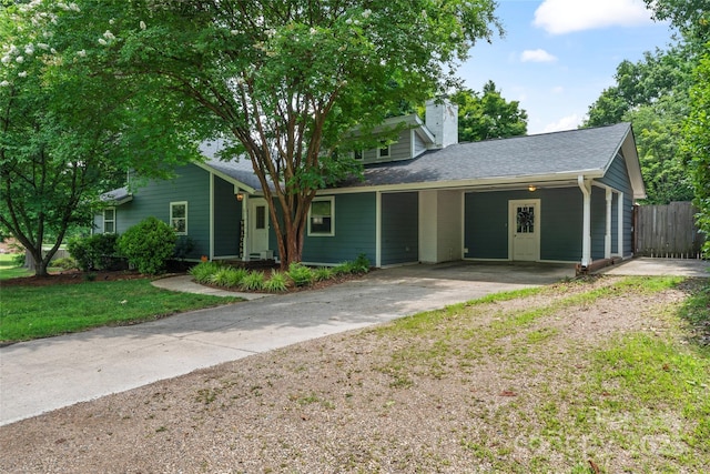 6313 Weddington Rd, Concord, NC 28027 - view of front of home with concrete driveway, a chimney, and a shingled roof
