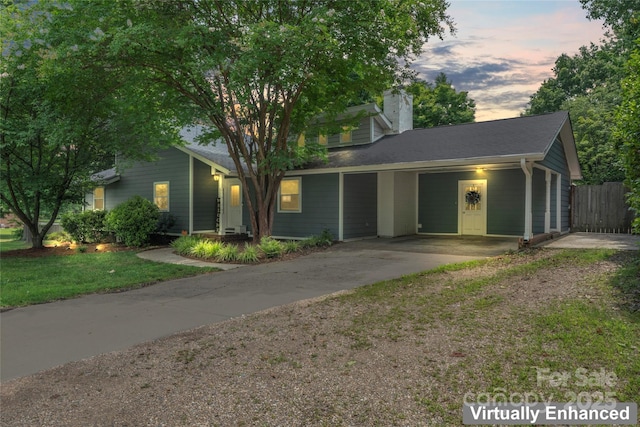 6313 Weddington Rd, Concord, NC 28027 - view of front of house with driveway and a chimney