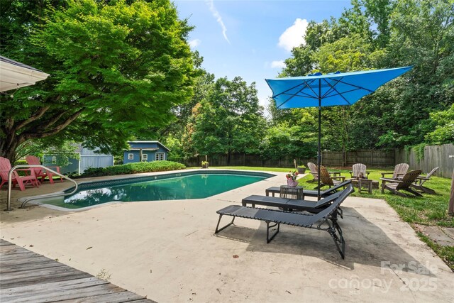 6313 Weddington Rd, Concord, NC 28027 - view of pool with a fenced backyard, a patio, view of scattered trees, and an outdoor structure