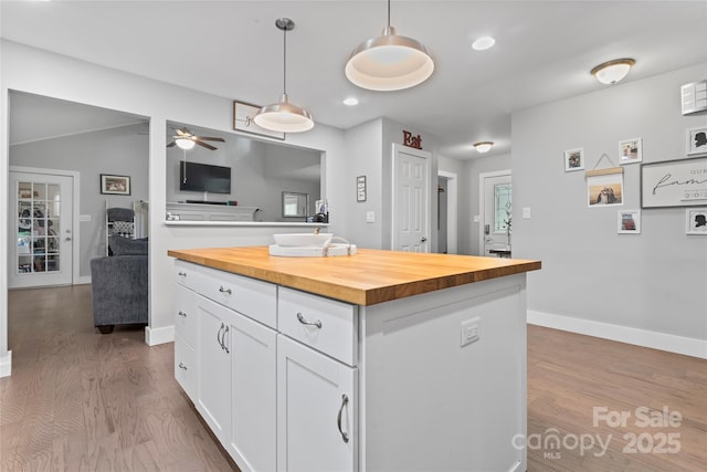 6313 Weddington Rd, Concord, NC 28027 - kitchen with butcher block countertops, wood finished floors, white cabinetry, pendant lighting, and recessed lighting