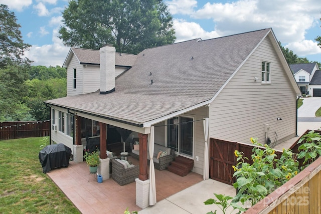 207 Spaniel Dr SE, Concord, NC 28025 - rear view of property featuring a shingled roof, a patio, and a chimney