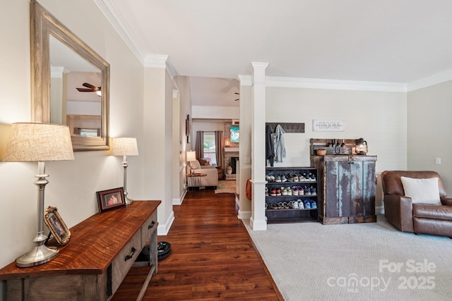 207 Spaniel Dr SE, Concord, NC 28025 - living area featuring crown molding, ornate columns, wood finished floors, and ceiling fan