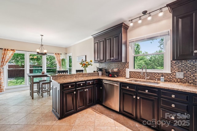 207 Spaniel Dr SE, Concord, NC 28025 - kitchen featuring stainless steel dishwasher, tasteful backsplash, healthy amount of natural light, light tile patterned floors, and ornamental molding