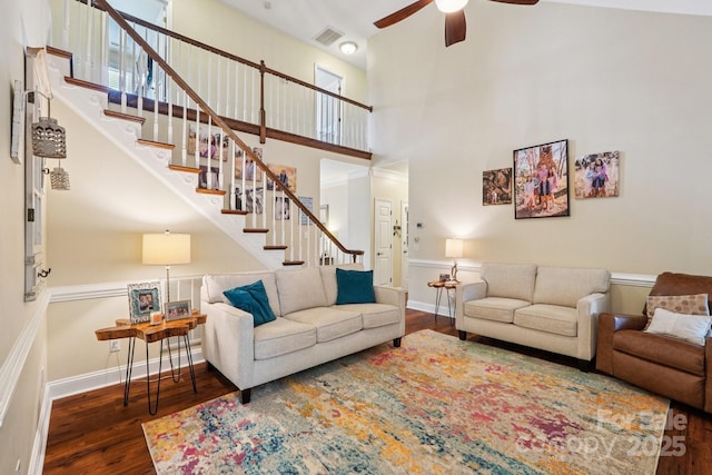 207 Spaniel Dr SE, Concord, NC 28025 - living area with a ceiling fan, stairs, wood finished floors, and a towering ceiling