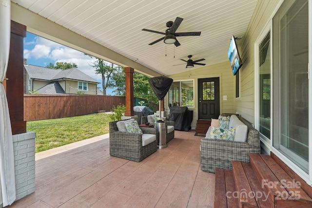 207 Spaniel Dr SE, Concord, NC 28025 - fenced backyard featuring ceiling fan, a patio area, and outdoor lounge area