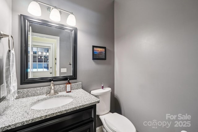 207 Spaniel Dr SE, Concord, NC 28025 - bathroom featuring toilet and vanity