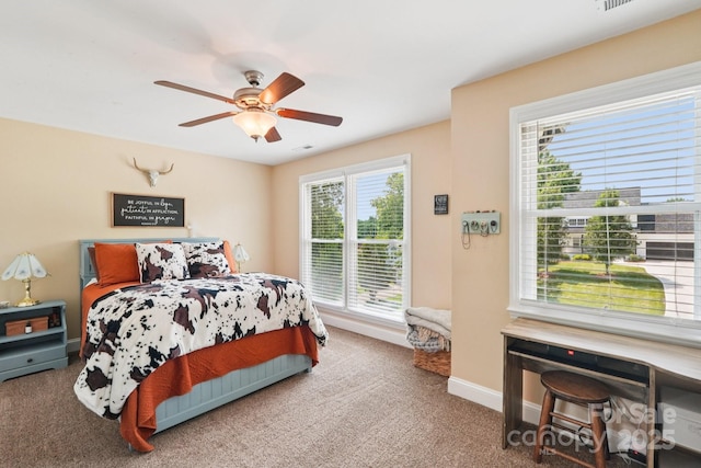 207 Spaniel Dr SE, Concord, NC 28025 - carpeted bedroom with baseboards and a ceiling fan