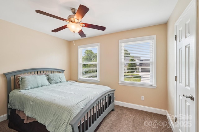 207 Spaniel Dr SE, Concord, NC 28025 - carpeted bedroom with baseboards and a ceiling fan