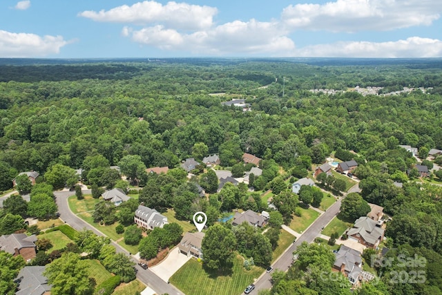 207 Spaniel Dr SE, Concord, NC 28025 - aerial view of residential area with a heavily wooded area