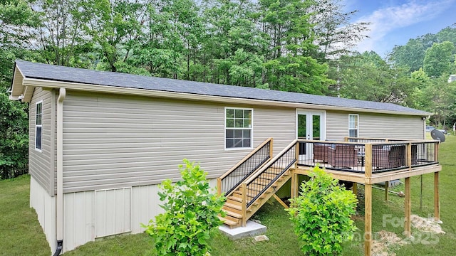 8692 Lambs Way, Connelly Springs, NC 28612 - back of house featuring a deck and a yard