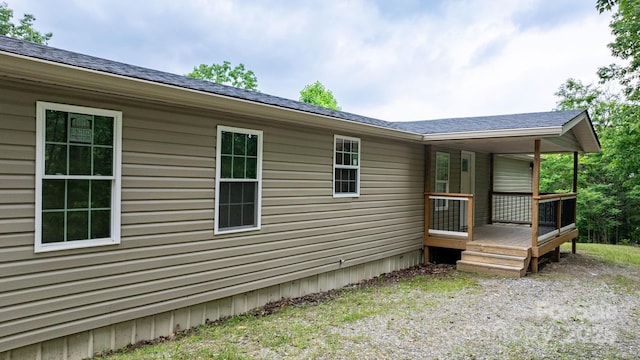 8692 Lambs Way, Connelly Springs, NC 28612 - view of side of property with a shingled roof and a wooden deck