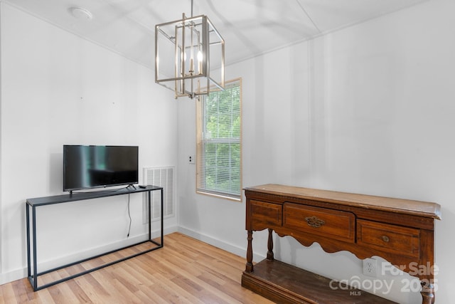 8692 Lambs Way, Connelly Springs, NC 28612 - bedroom with a chandelier, wood finished floors, and baseboards