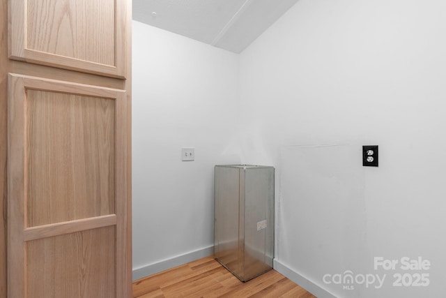 8692 Lambs Way, Connelly Springs, NC 28612 - laundry room with light wood-style floors, baseboards, and electric dryer hookup