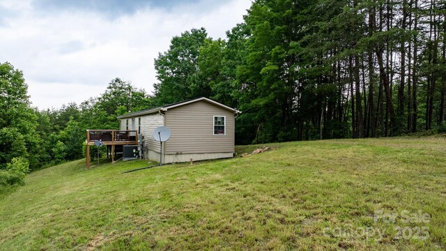 8692 Lambs Way, Connelly Springs, NC 28612 - view of grassy yard featuring a deck