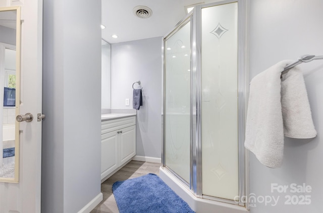 147 Buck And Doe Ln, Statesville, NC 28625 - full bath with vanity, a shower stall, baseboards, and recessed lighting