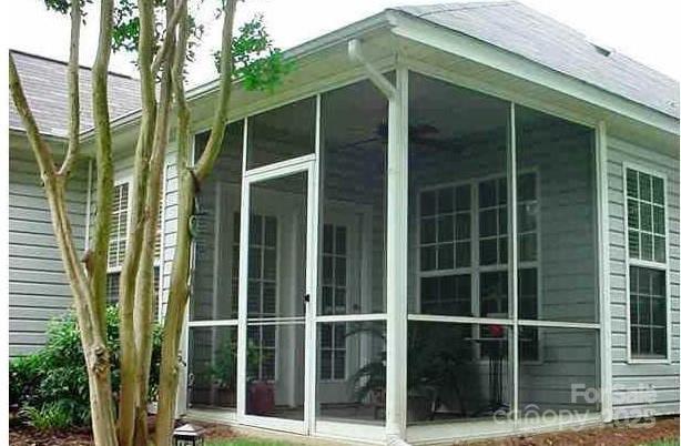 4492 Antelope Ln, Charlotte, NC 28269 - view of property exterior featuring a sunroom