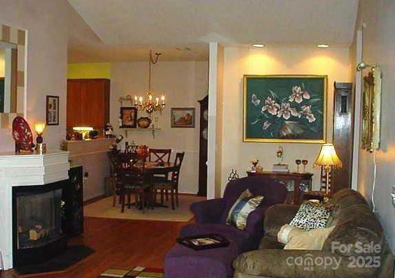 4492 Antelope Ln, Charlotte, NC 28269 - living area featuring a chandelier and wood finished floors
