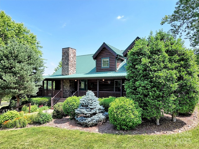 32 Tibi Ln, Waynesville, NC 28785 - log cabin with a chimney, covered porch, metal roof, and a front yard