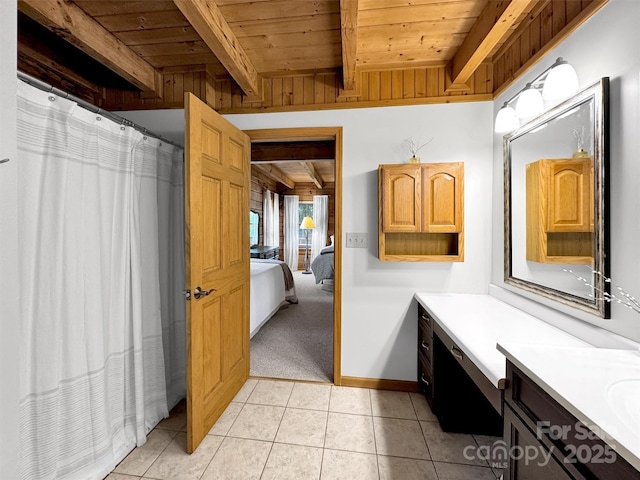 32 Tibi Ln, Waynesville, NC 28785 - full bathroom with wooden ceiling with exposed beams, vanity, tile patterned floors, baseboards, and curtained shower