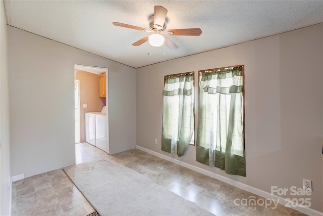 4630 Irish Potato Rd, Kannapolis, NC 28083 - unfurnished room featuring independent washer and dryer, ceiling fan, and a textured ceiling