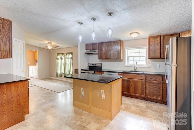 4630 Irish Potato Rd, Kannapolis, NC 28083 - kitchen with freestanding refrigerator, stainless steel range with electric cooktop, a sink, washer and clothes dryer, and dark countertops