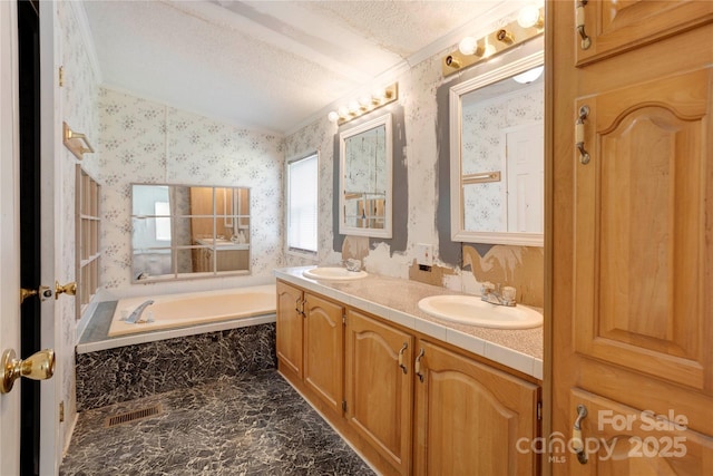 4630 Irish Potato Rd, Kannapolis, NC 28083 - bathroom featuring wallpapered walls, double vanity, a textured ceiling, a bath, and marble finish flooring