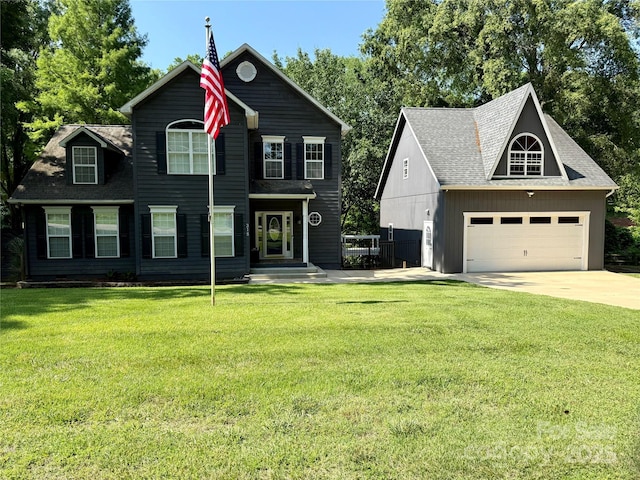 315 Wood Duck Loop, Mooresville, NC 28117 - view of front facade featuring concrete driveway, a front lawn, a garage, and a shingled roof