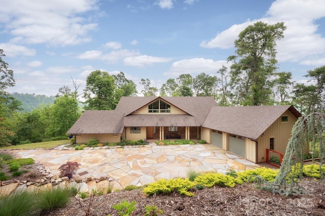 588 Long Branch Rd, Swannanoa, NC 28778 - view of front facade featuring an attached garage, roof with shingles, covered porch, and driveway