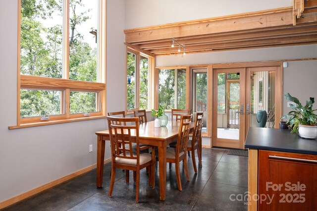 588 Long Branch Rd, Swannanoa, NC 28778 - dining room with baseboards, french doors, and beam ceiling