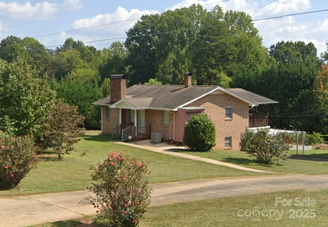 6229 Mountain Grove Rd, Hickory, NC 28602 - ranch-style home with a chimney, a front lawn, brick siding, and cooling unit