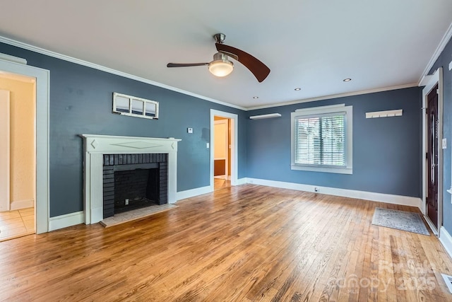 8255 Castor Rd, Salisbury, NC 28146 - unfurnished living room featuring wood-type flooring, a ceiling fan, ornamental molding, baseboards, and a brick fireplace