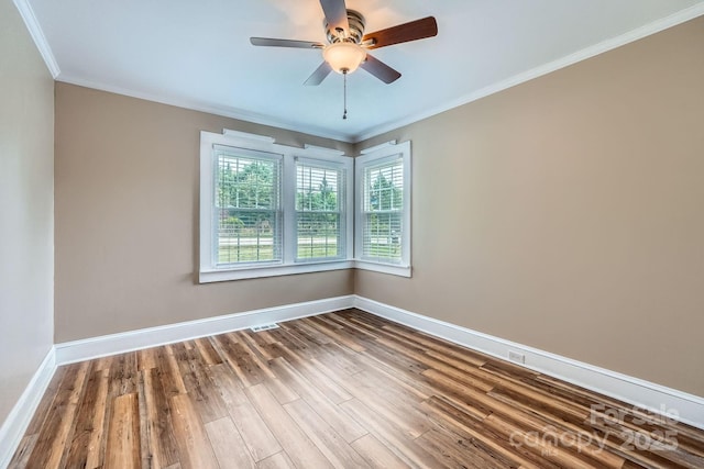 8255 Castor Rd, Salisbury, NC 28146 - spare room with wood finished floors, baseboards, crown molding, and a ceiling fan