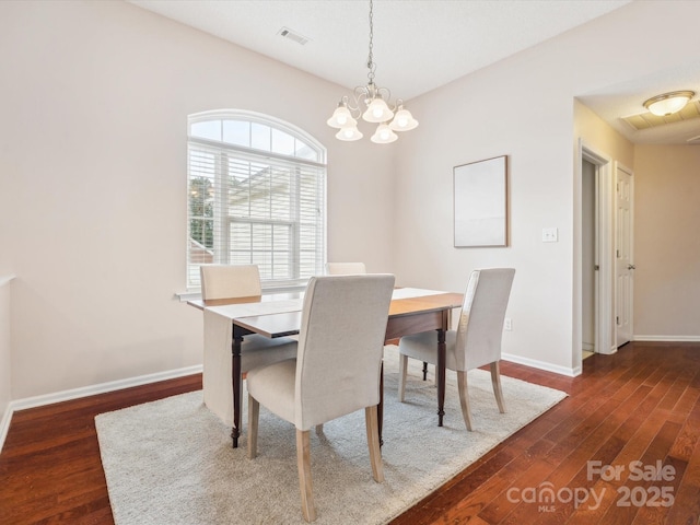 116 Birchwood Ct, Mount Holly, NC 28120 - dining room with dark wood-type flooring and a chandelier