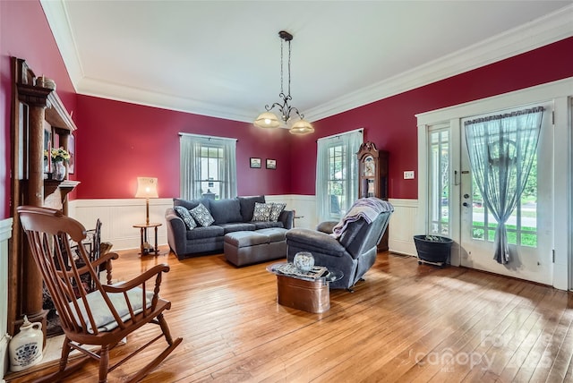 200 W 14th St, Salisbury, NC 28144 - living area featuring a wainscoted wall, ornamental molding, and light wood finished floors