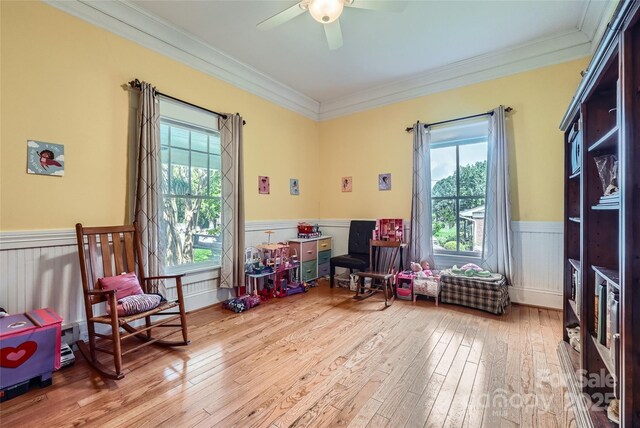 200 W 14th St, Salisbury, NC 28144 - game room with a wainscoted wall, hardwood / wood-style flooring, a ceiling fan, and ornamental molding