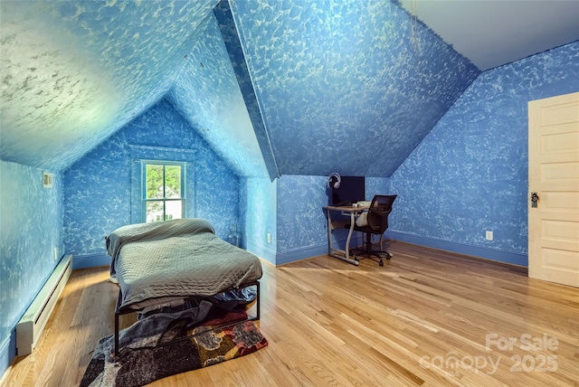 200 W 14th St, Salisbury, NC 28144 - bedroom with baseboard heating, wallpapered walls, lofted ceiling, wood finished floors, and baseboards