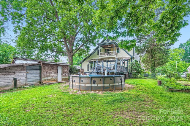 200 W 14th St, Salisbury, NC 28144 - back of house with a balcony, a yard, and an outdoor pool