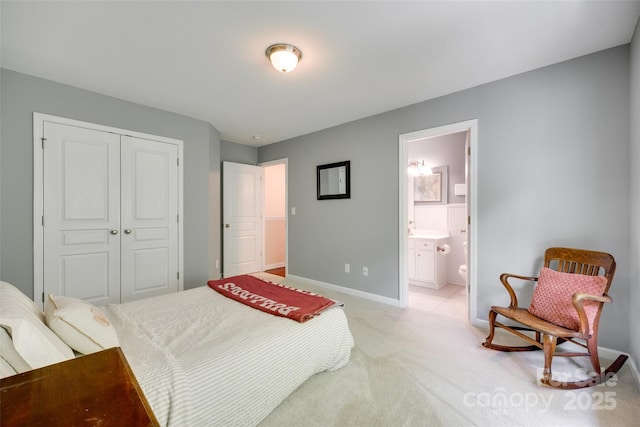 288 Sand Paver Way Unit 50, Fort Mill, SC 29708 - bedroom with a closet, baseboards, light carpet, and ensuite bath