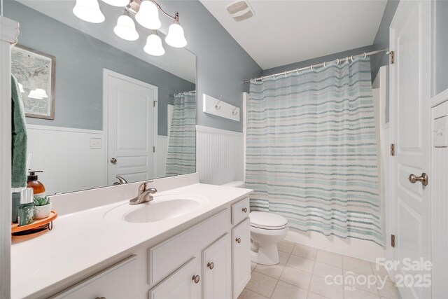 288 Sand Paver Way Unit 50, Fort Mill, SC 29708 - bathroom with a wainscoted wall, vanity, toilet, tile patterned flooring, and shower / tub combo