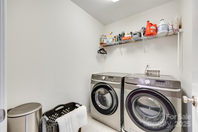 288 Sand Paver Way Unit 50, Fort Mill, SC 29708 - laundry area featuring washing machine and clothes dryer and tile patterned floors