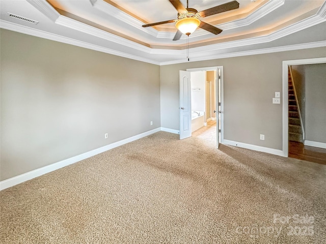 1625 Damascus Cir, Conover, NC 28613 - empty room with a raised ceiling, crown molding, ceiling fan, light colored carpet, and baseboards