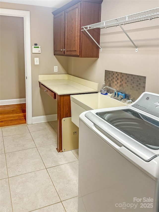 1625 Damascus Cir, Conover, NC 28613 - washroom with washer / dryer, cabinet space, light tile patterned floors, and baseboards
