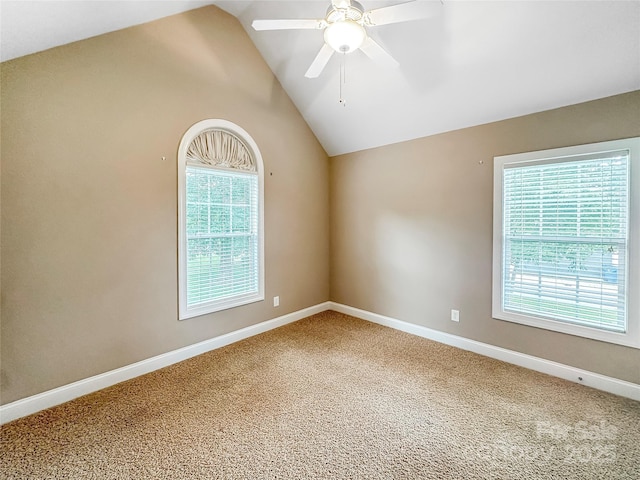1625 Damascus Cir, Conover, NC 28613 - empty room featuring vaulted ceiling, carpet floors, plenty of natural light, a ceiling fan, and baseboards