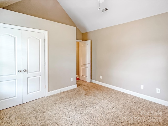 1625 Damascus Cir, Conover, NC 28613 - unfurnished bedroom featuring carpet flooring, baseboards, a closet, and vaulted ceiling