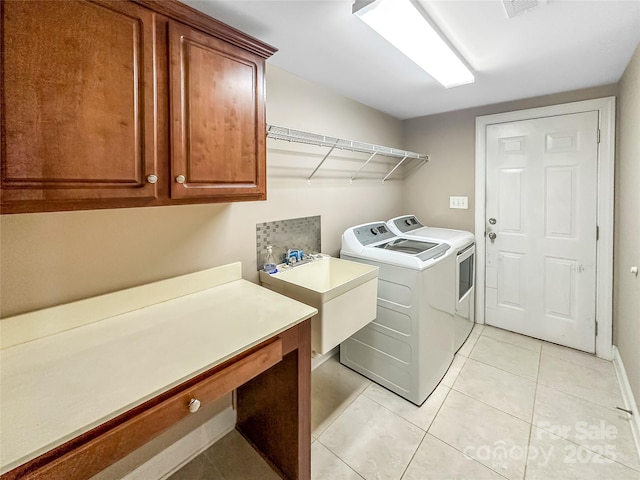 1625 Damascus Cir, Conover, NC 28613 - laundry area featuring cabinet space, washer and dryer, an office area, and light tile patterned floors