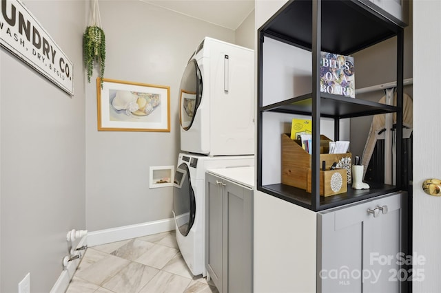 8109 Hawk Crest Ct, Charlotte, NC 28270 - laundry area with stacked washer / dryer and light marble finish flooring
