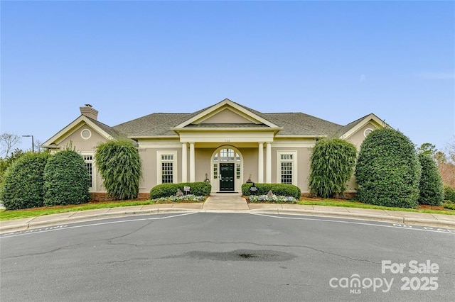 8109 Hawk Crest Ct, Charlotte, NC 28270 - neoclassical / greek revival house featuring a chimney, stucco siding, and uncovered parking