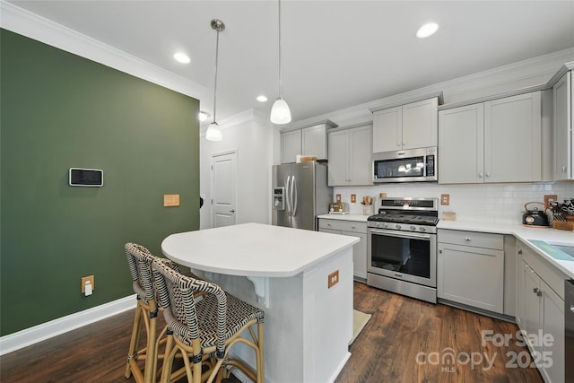 2034 Houle Ln, Charlotte, NC 28214 - kitchen with appliances with stainless steel finishes, gray cabinetry, ornamental molding, a center island, and backsplash