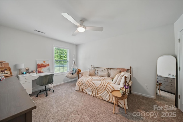 2034 Houle Ln, Charlotte, NC 28214 - carpeted bedroom with baseboards, ceiling fan, and a desk